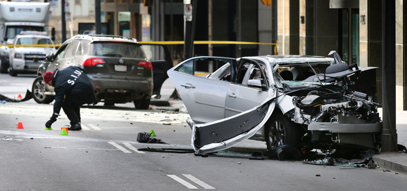 Investigators at a two-car collision on Bay Street, Toronto (March 2016)